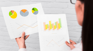 Teacher is looking at charts and graphs in research