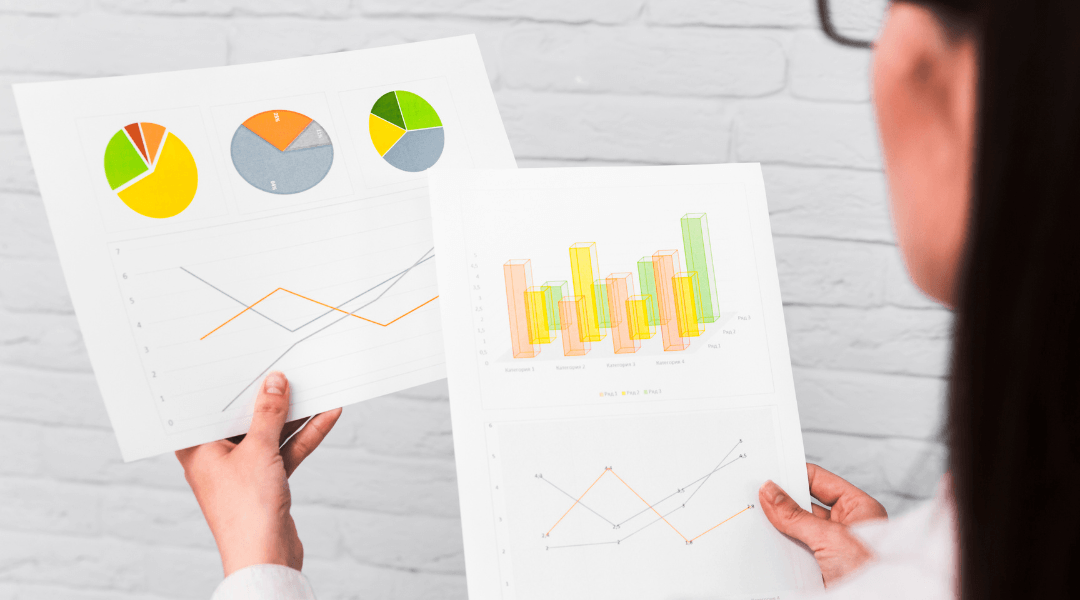 Teacher is looking at charts and graphs in research