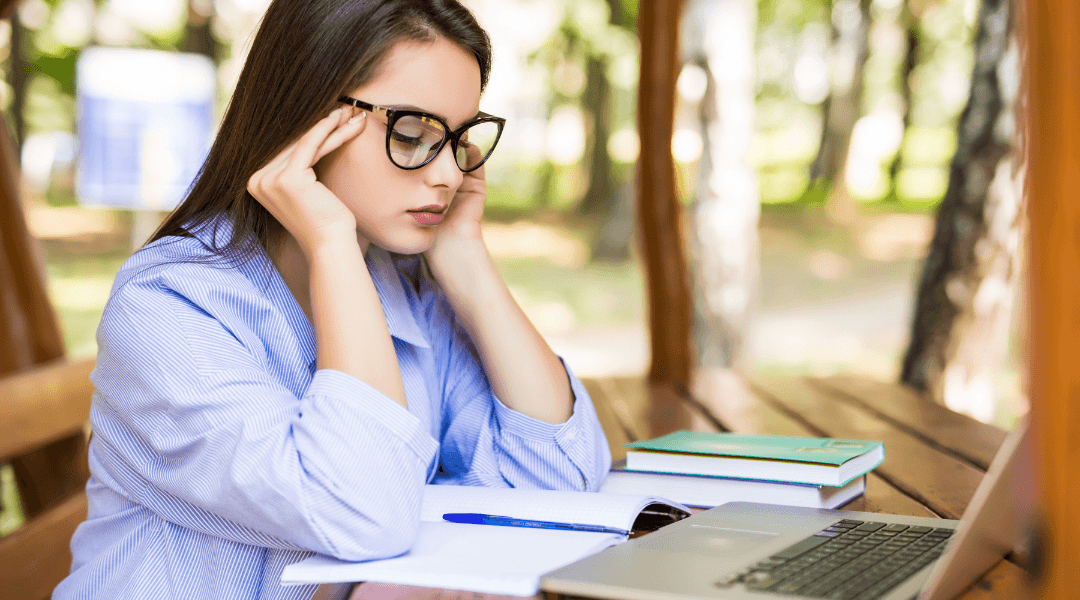 girl is tired to find good thesis writing tips