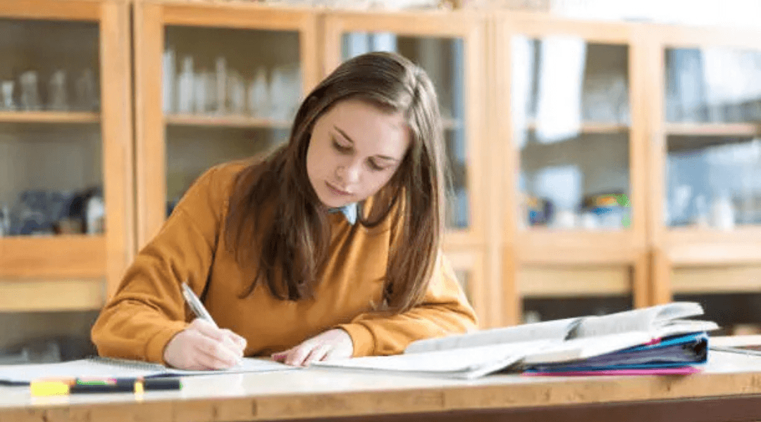 a girl is writing how to write an abstract